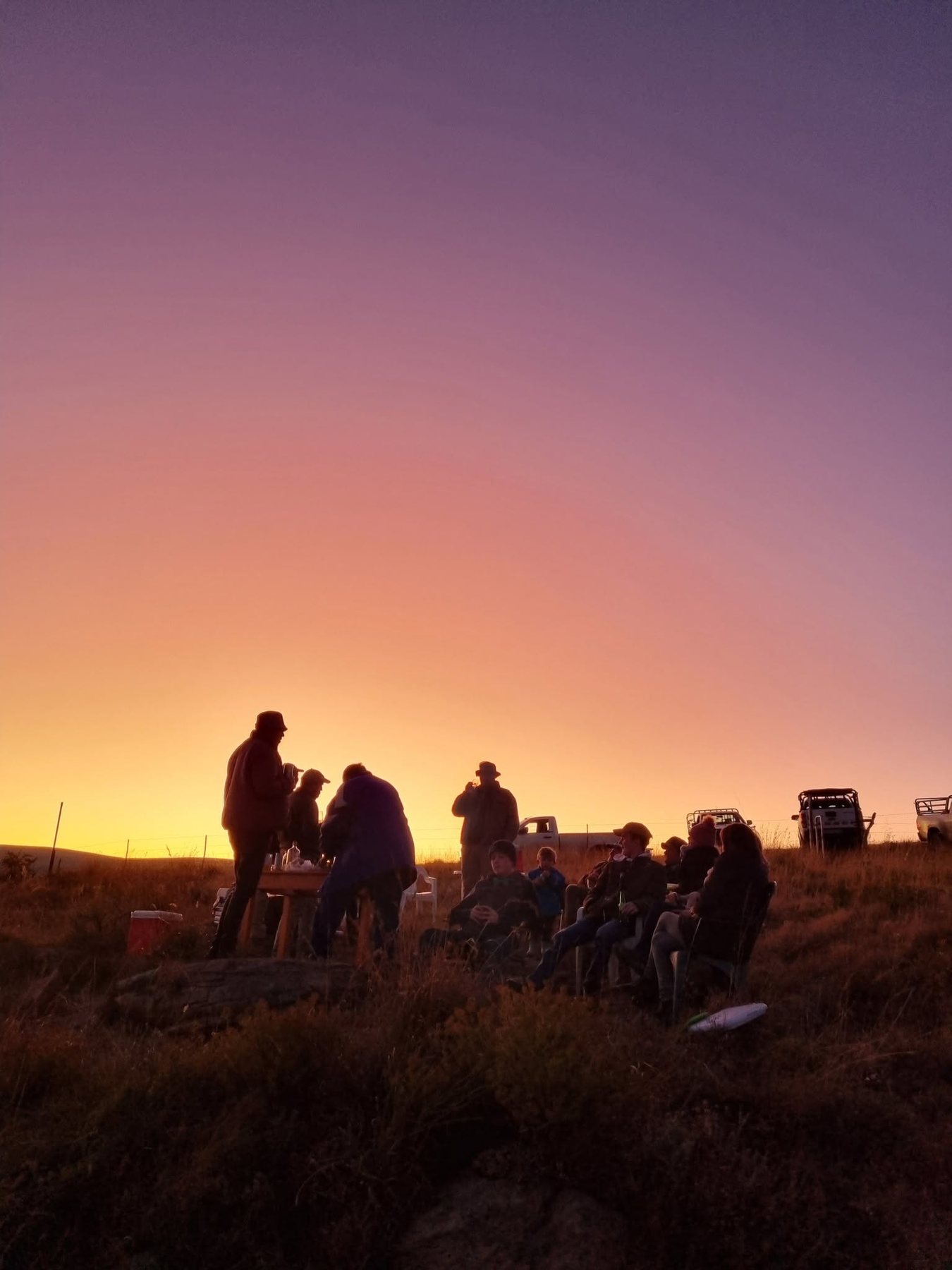 Thomas River community gathering at sunset